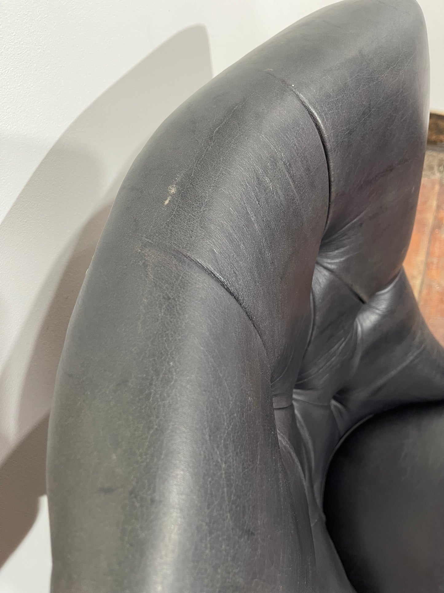 Pair of high back black studded chairs