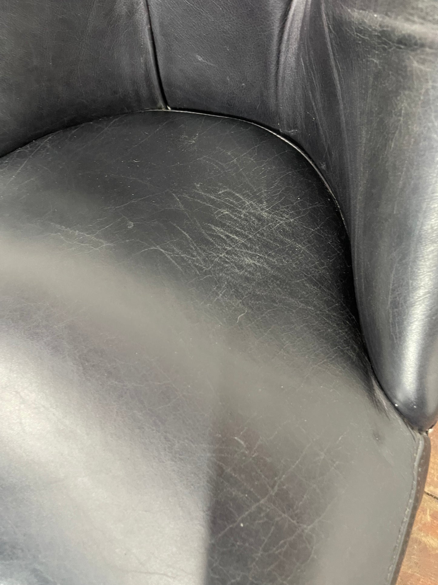 Pair of high back black studded chairs