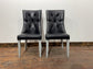 Pair of high back black studded chairs