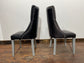 Pair of high back black studded chairs