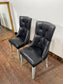 Pair of high back black studded chairs