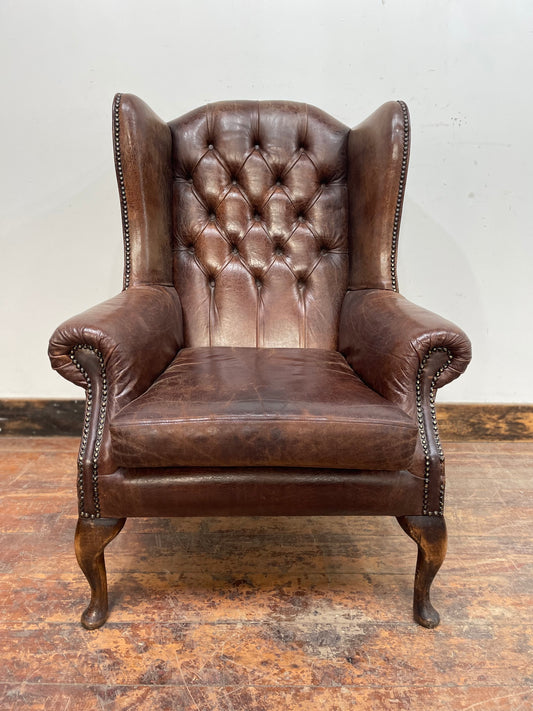 Vintage style brown leather wingback Chesterfield armchair
