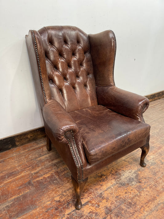 Vintage style brown leather wingback Chesterfield armchair