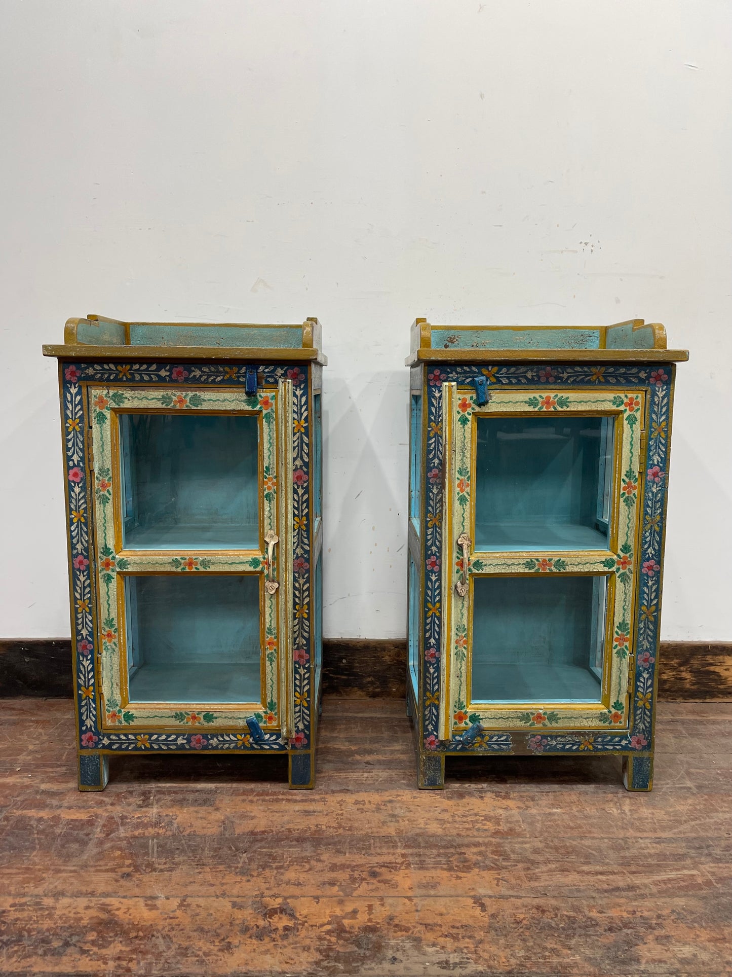 Pair of hand painted bedside tables / cabinets with glass panels