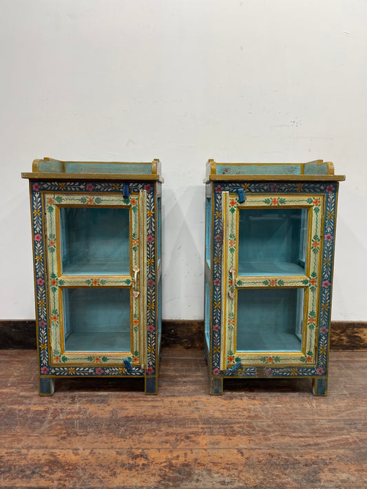 Pair of hand painted bedside tables / cabinets with glass panels