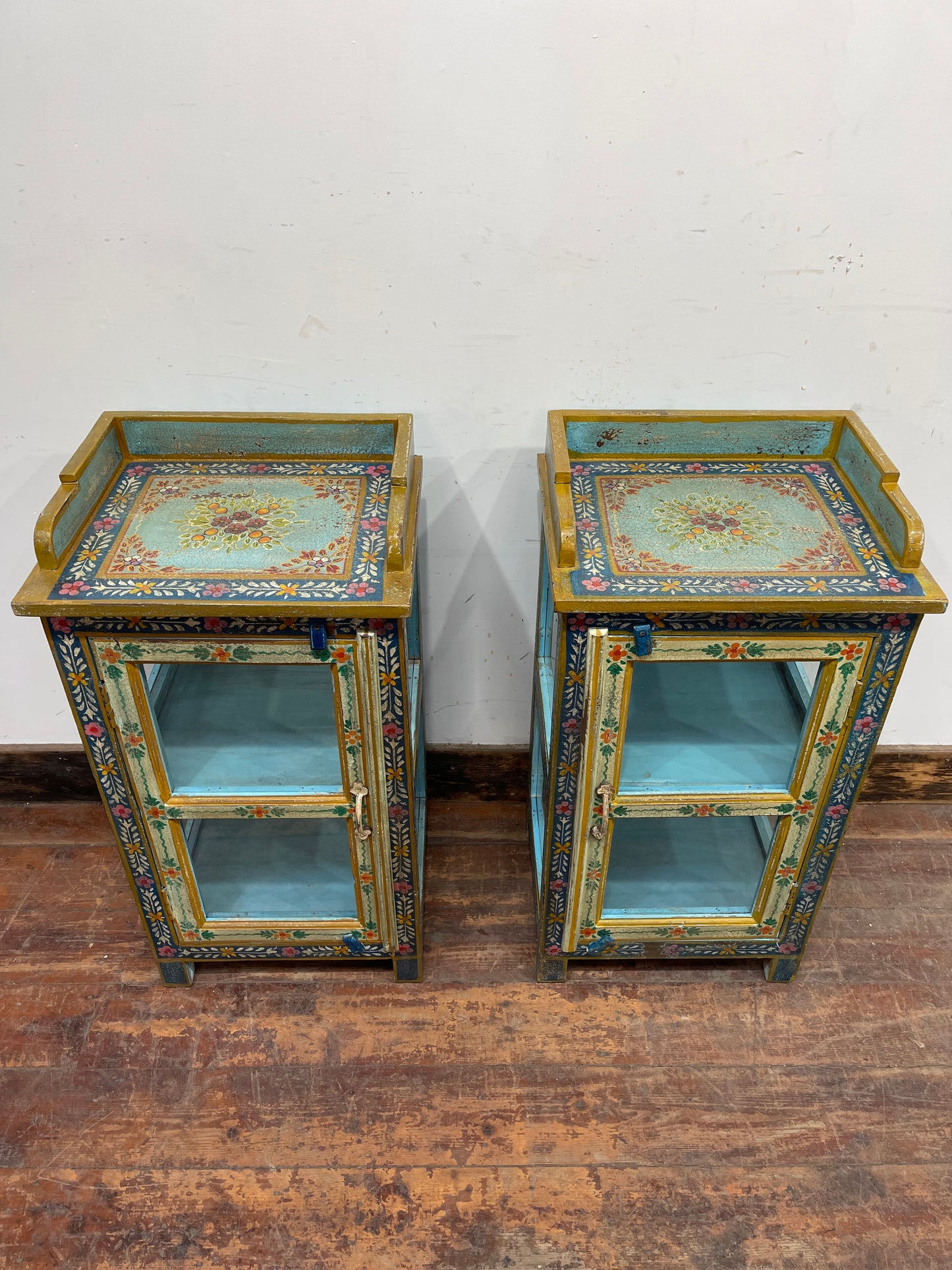 Pair of hand painted bedside tables / cabinets with glass panels