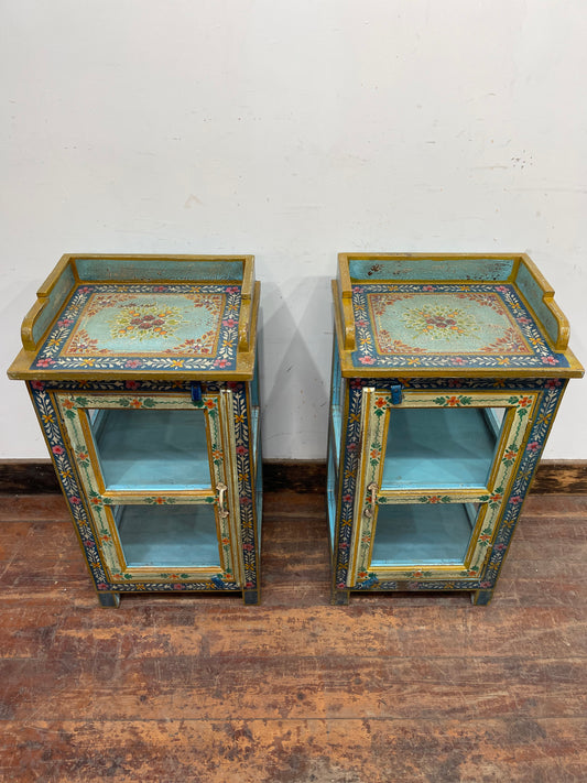 Pair of hand painted bedside tables / cabinets with glass panels