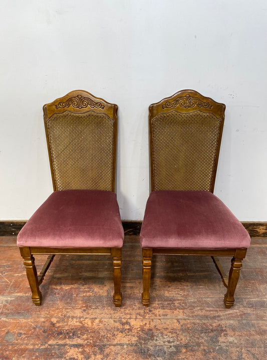 A pair of vintage style pink chairs