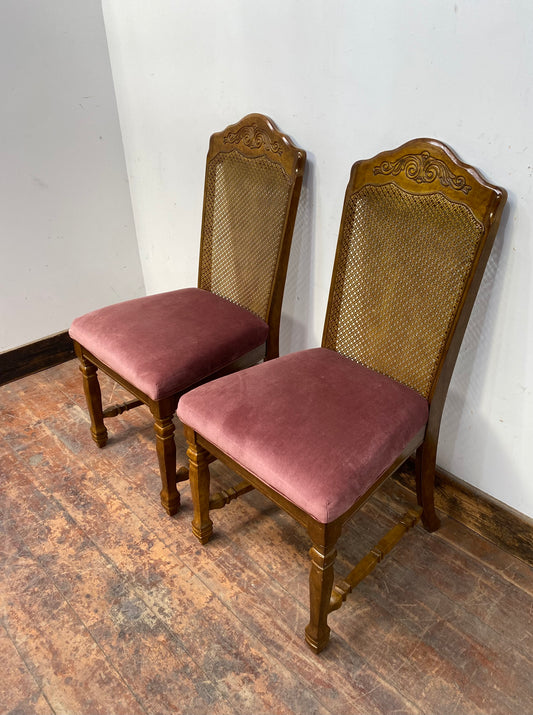 A pair of vintage style pink chairs