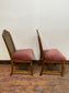 A pair of vintage style pink chairs
