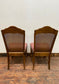 A pair of vintage style pink chairs
