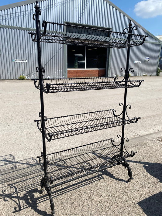 Black metal shelving rack on wheels