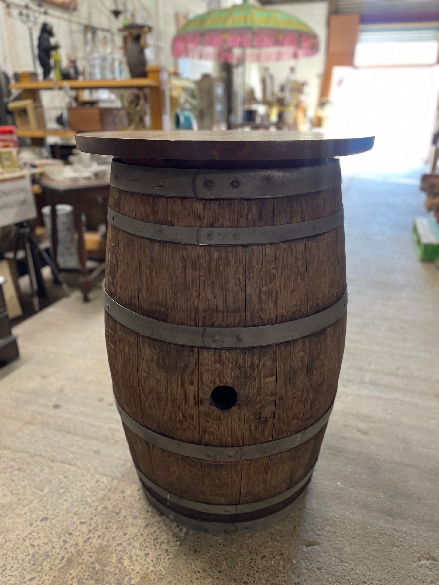 Barrel with round table top and 4 stools for pub / bar