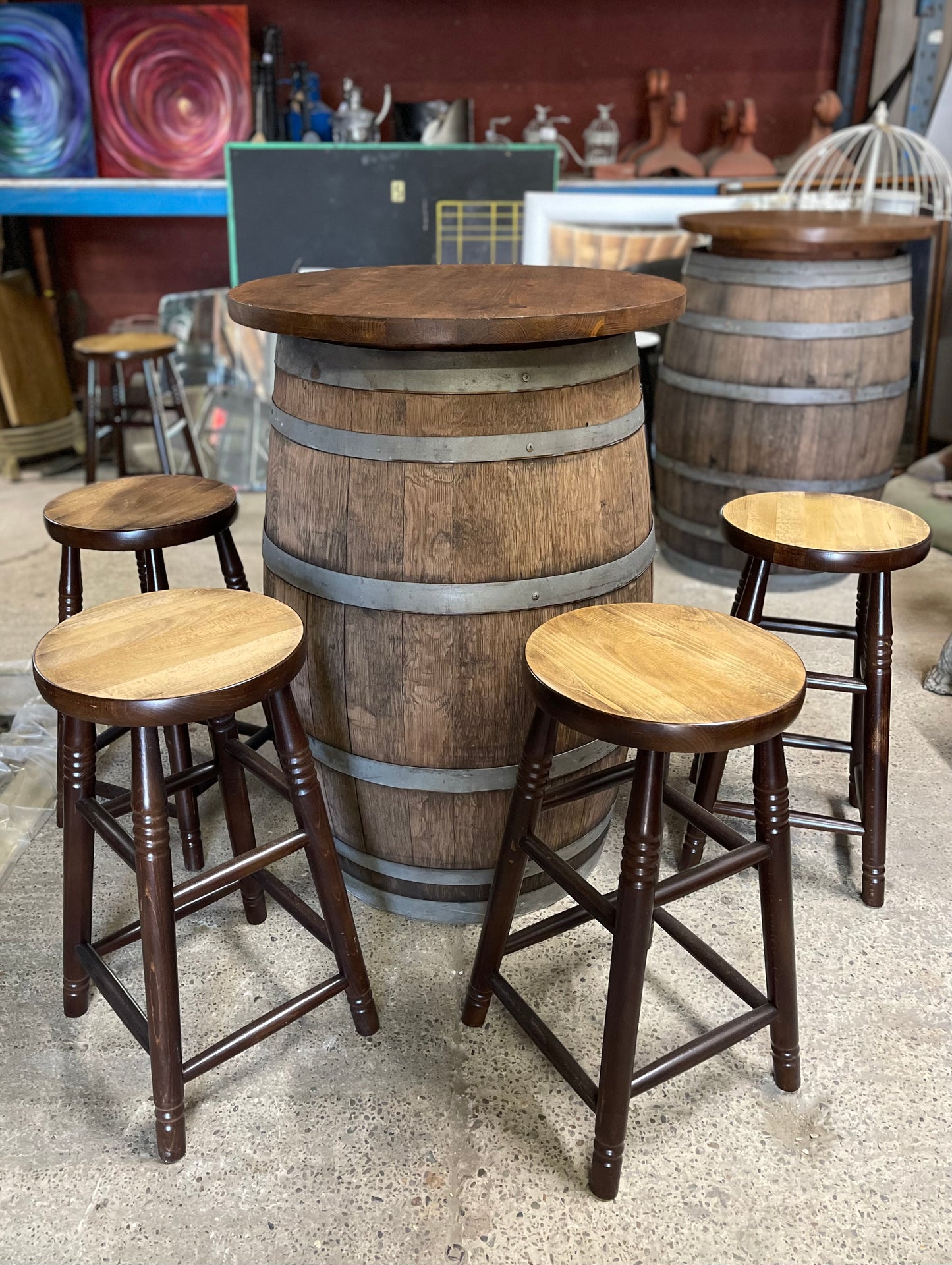 Barrel with round table top and 4 stools for pub / bar