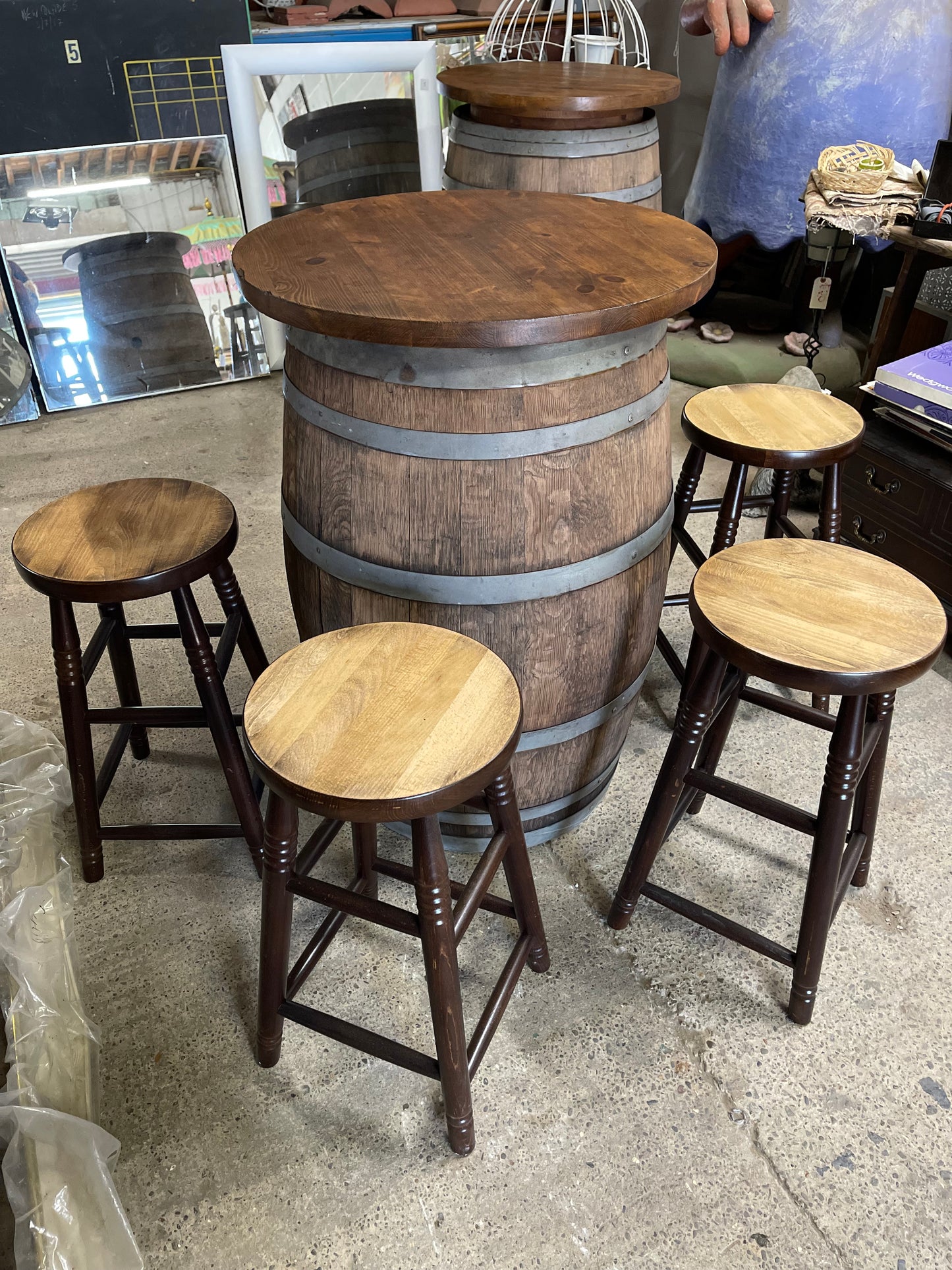 Barrel with round table top and 4 stools for pub / bar