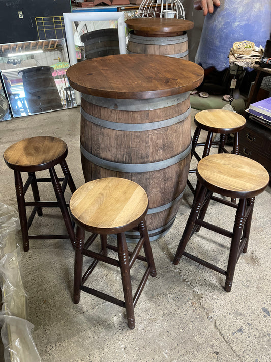 Barrel with round table top and 4 stools for pub / bar