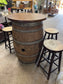 Barrel with round table top and 4 stools for pub / bar