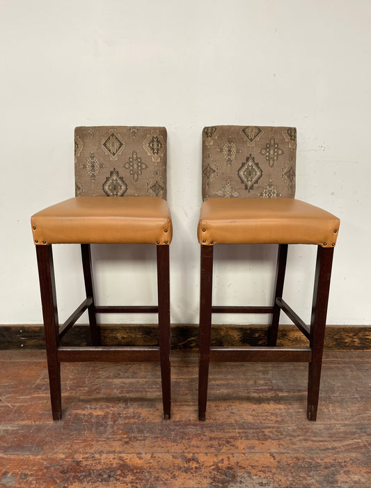 Pair of mustard yellow and patterned fabric bar stools