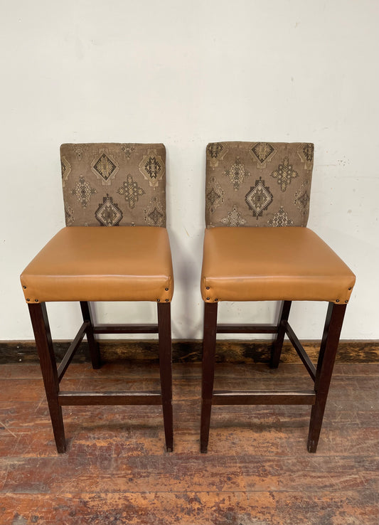 Pair of mustard yellow and patterned fabric bar stools