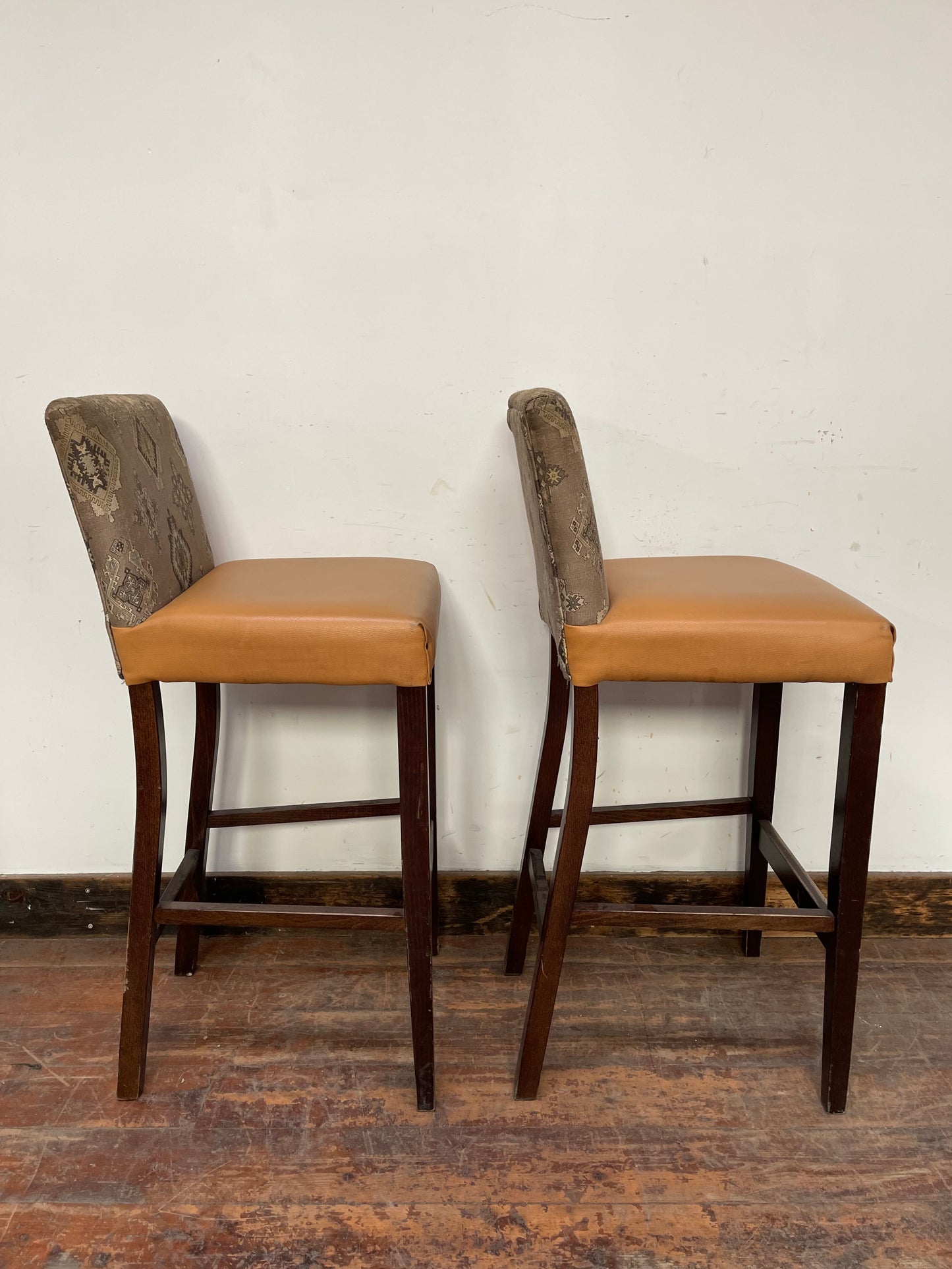 Pair of mustard yellow and patterned fabric bar stools