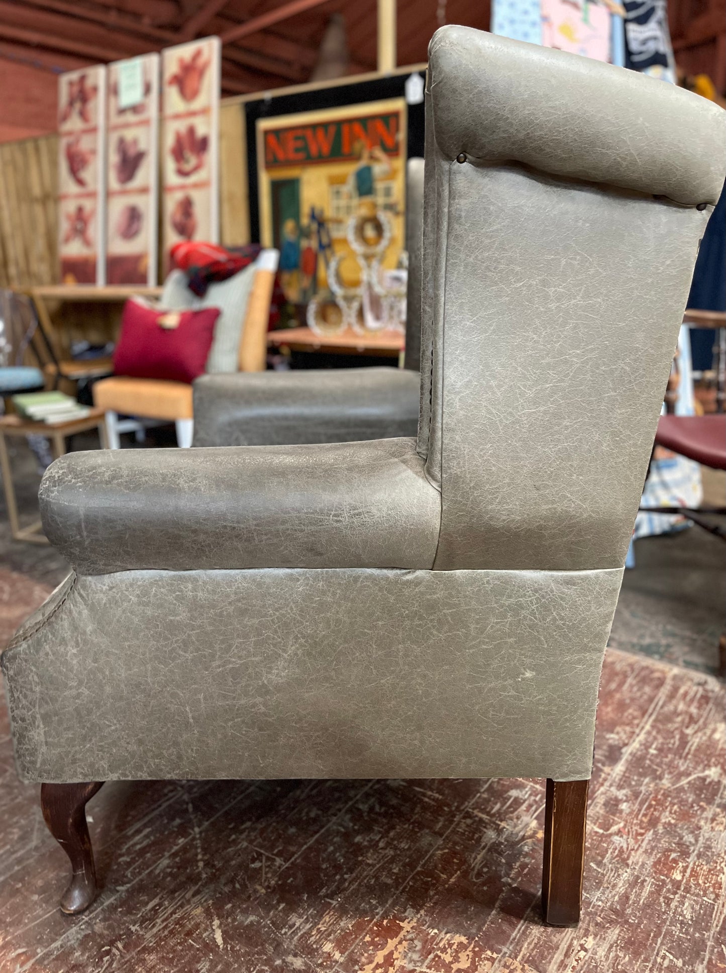 Grey Chesterfield style wingback armchair