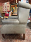 Grey Chesterfield style wingback armchair