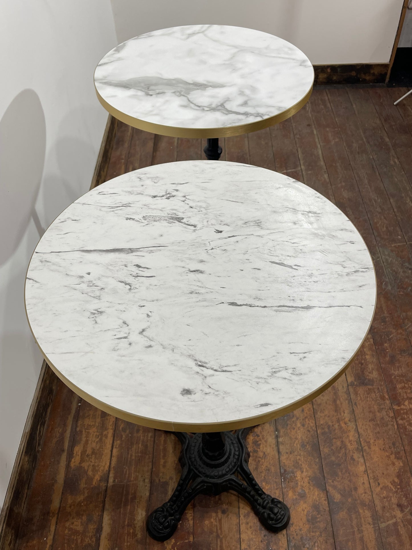 Pair of High Bar Poseur Tables Marble Effect Tops Gold Edge Cast Iron Bases