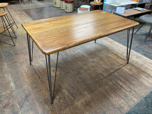 Stylish mango wood dining table with metal legs