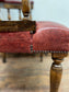 Stunning red leather captain's chair with wooden spindle back