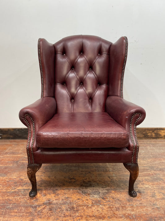 Dark red / oxblood leather wingback armchair