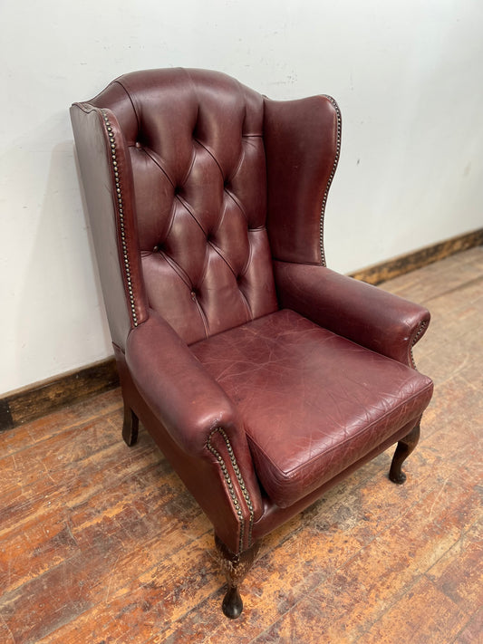 Dark red / oxblood leather wingback armchair