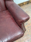 Dark red / oxblood leather wingback armchair