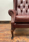 Dark red / oxblood leather wingback armchair