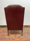 Dark red / oxblood leather wingback armchair