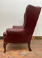Dark red / oxblood leather wingback armchair