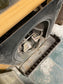 Old cast iron fireplace with decorative fender