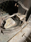 Old cast iron fireplace with decorative fender