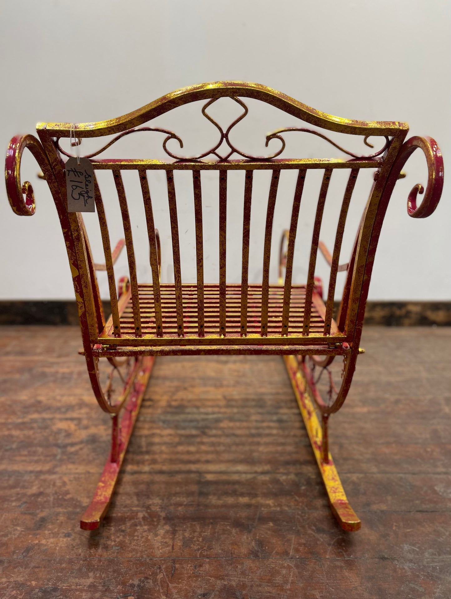 Red and gold Christmas sleigh including reindeer figure