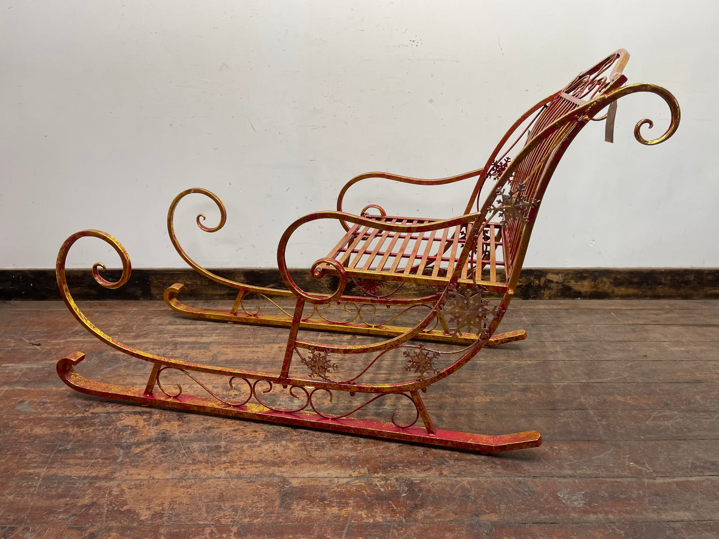 Large red and gold metal Christmas sleigh