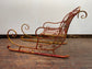 Red and gold Christmas sleigh including reindeer figure