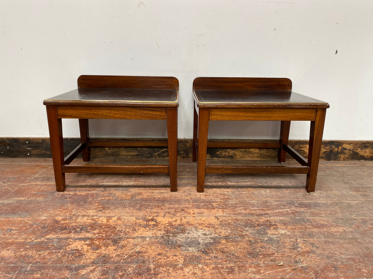Pair of antique 1940s black leather and gold side tables