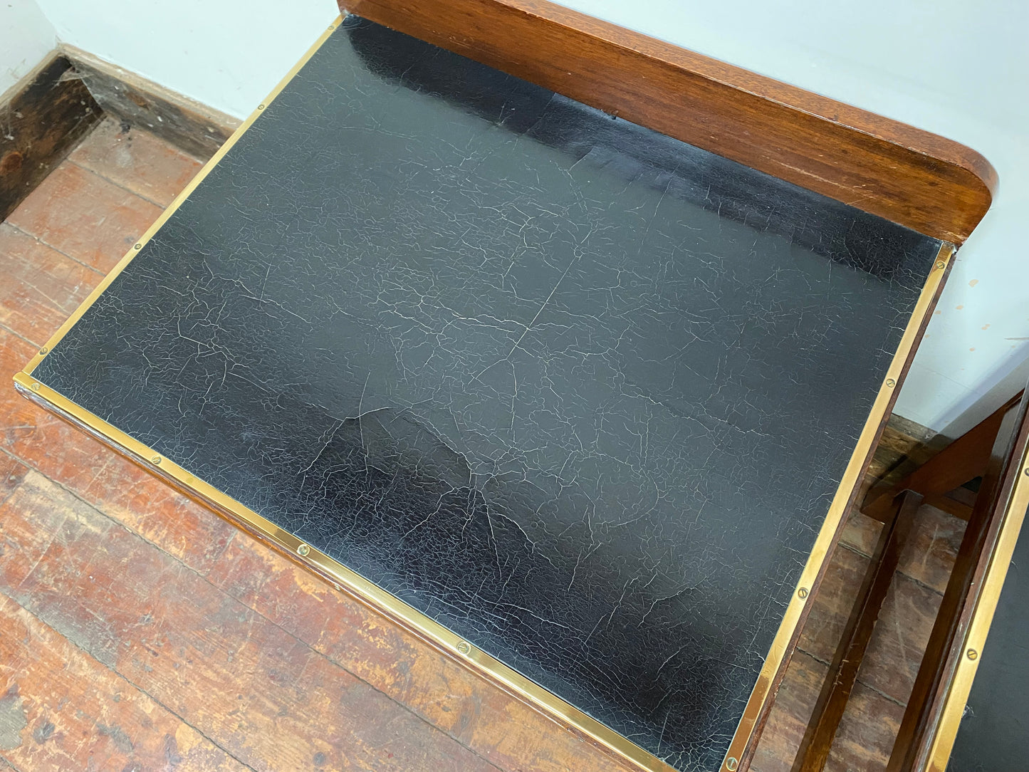 Pair of antique 1940s black leather and gold side tables