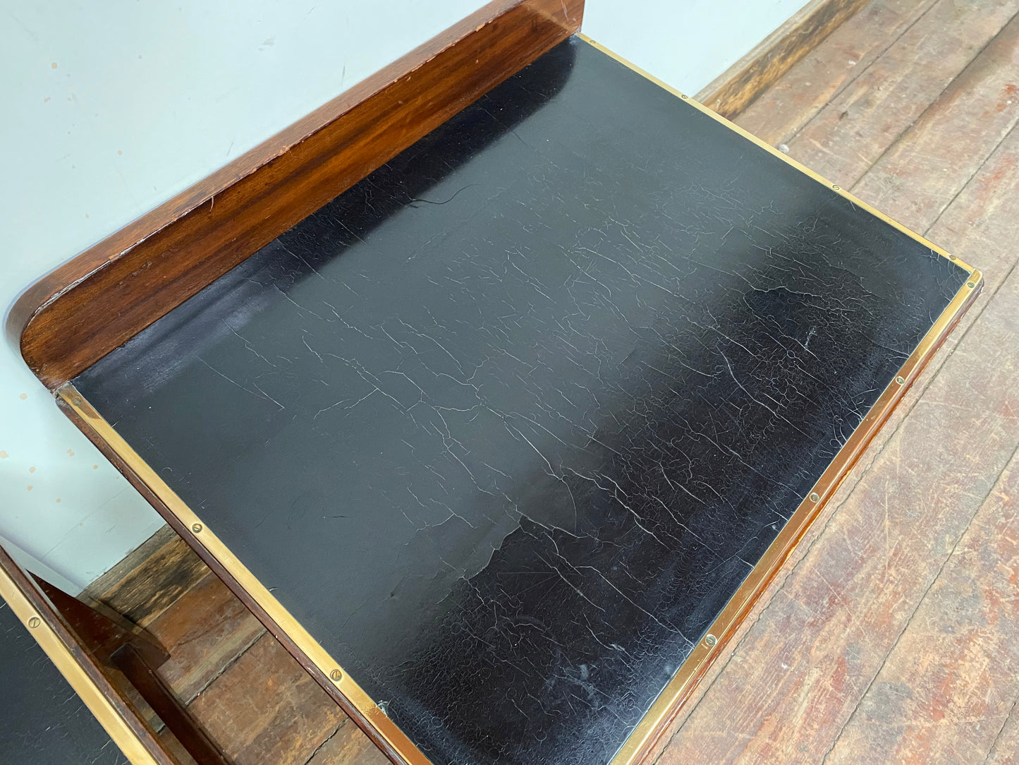 Pair of antique 1940s black leather and gold side tables
