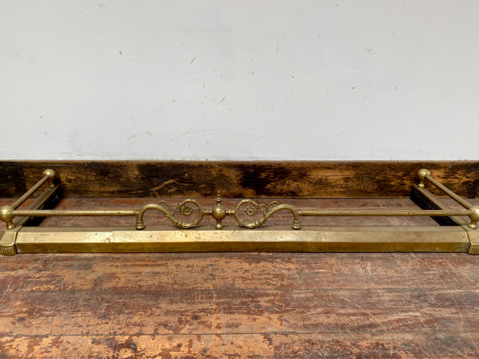 Ornate antique brass fire fender