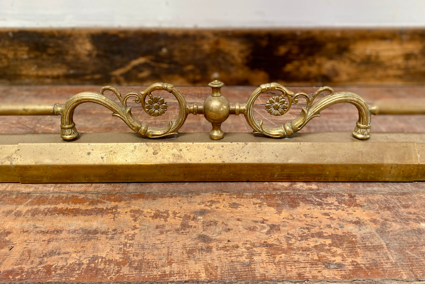 Ornate antique brass fire fender