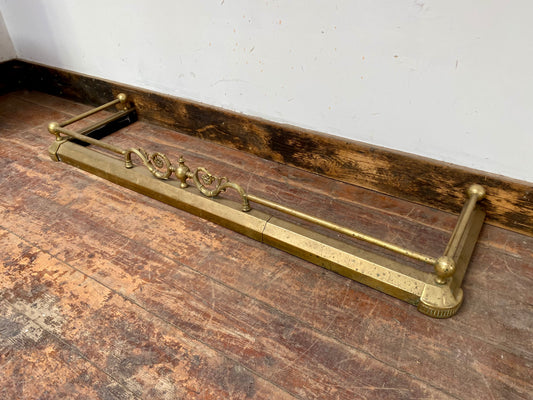 Ornate antique brass fire fender