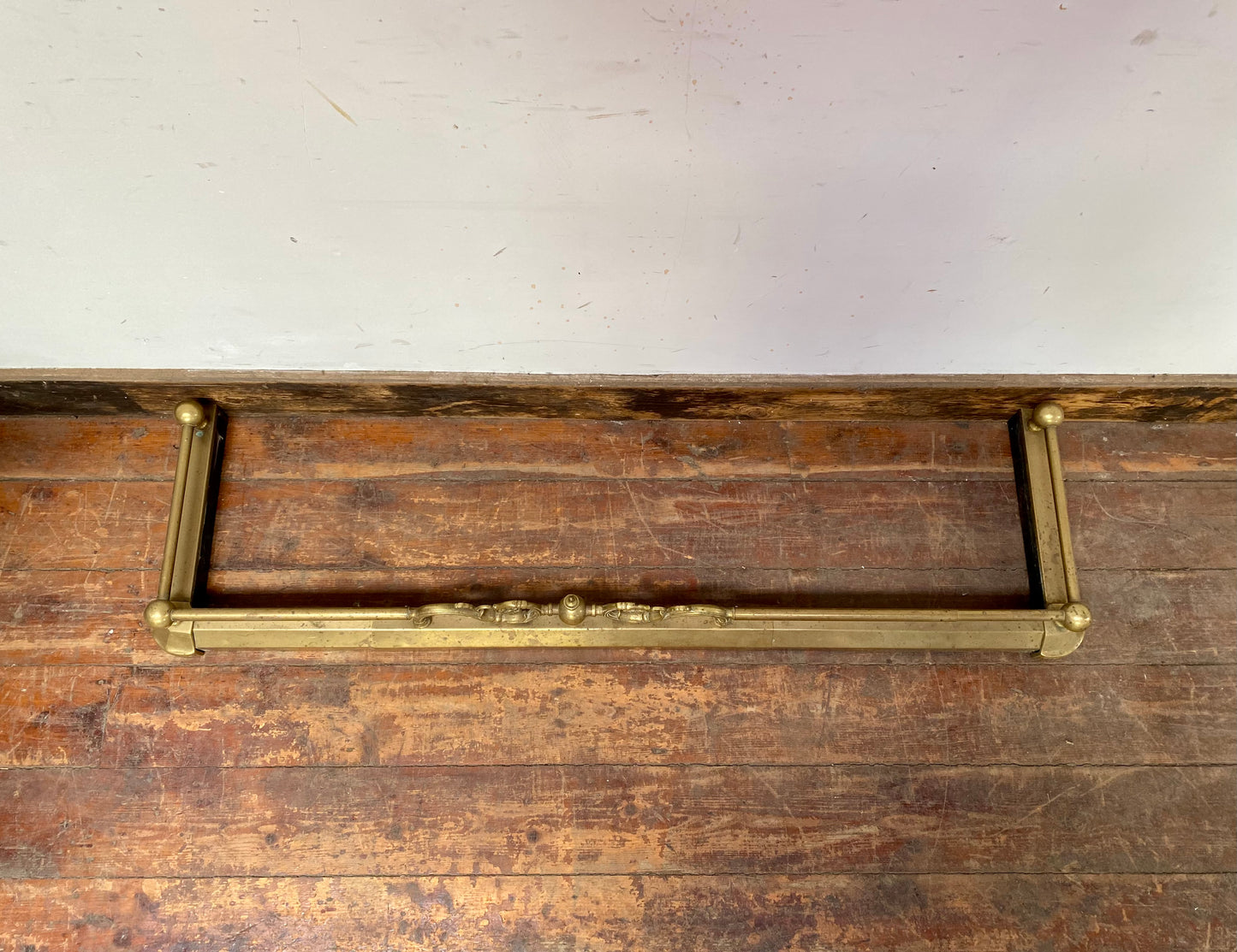 Ornate antique brass fire fender