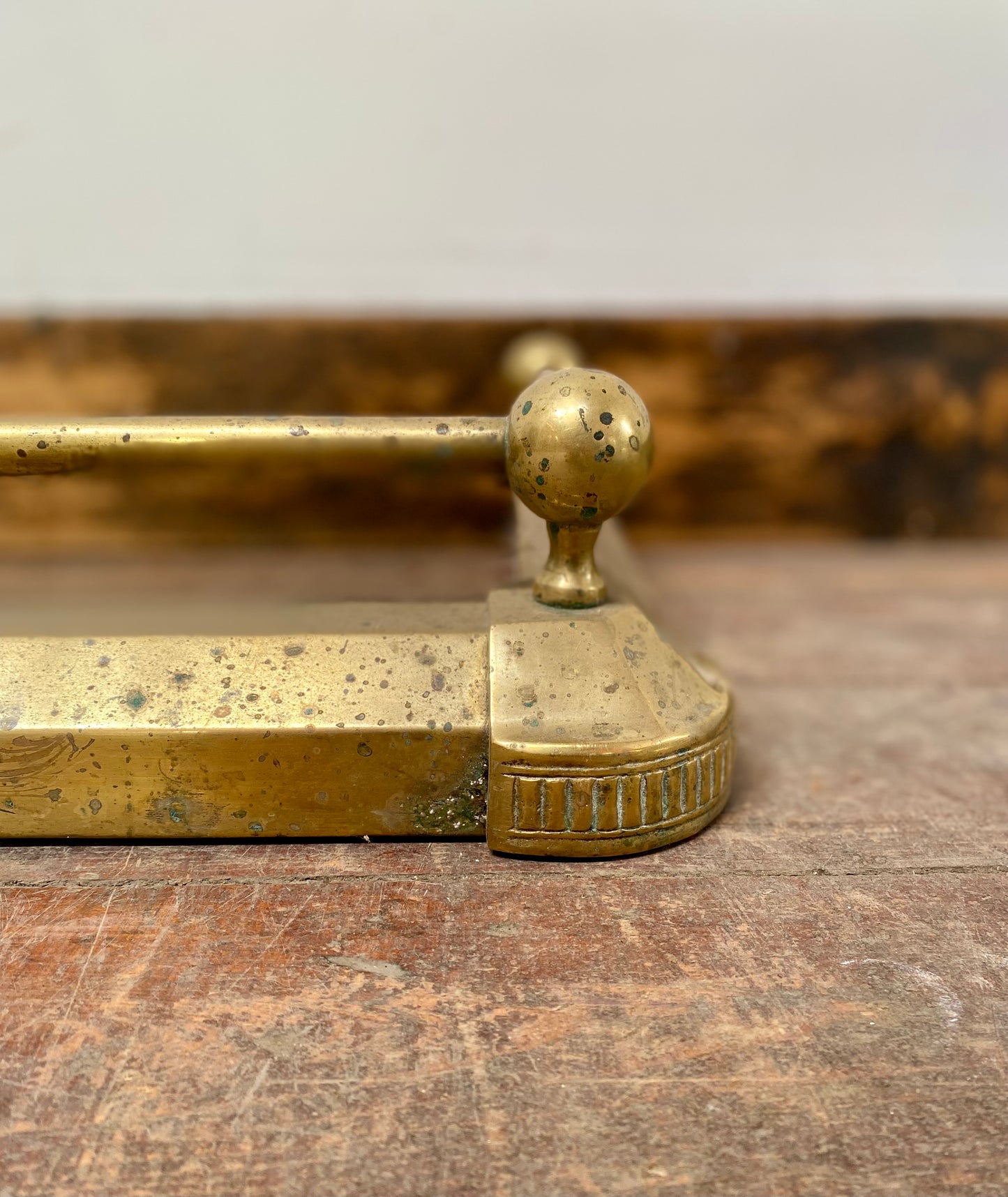 Ornate antique brass fire fender