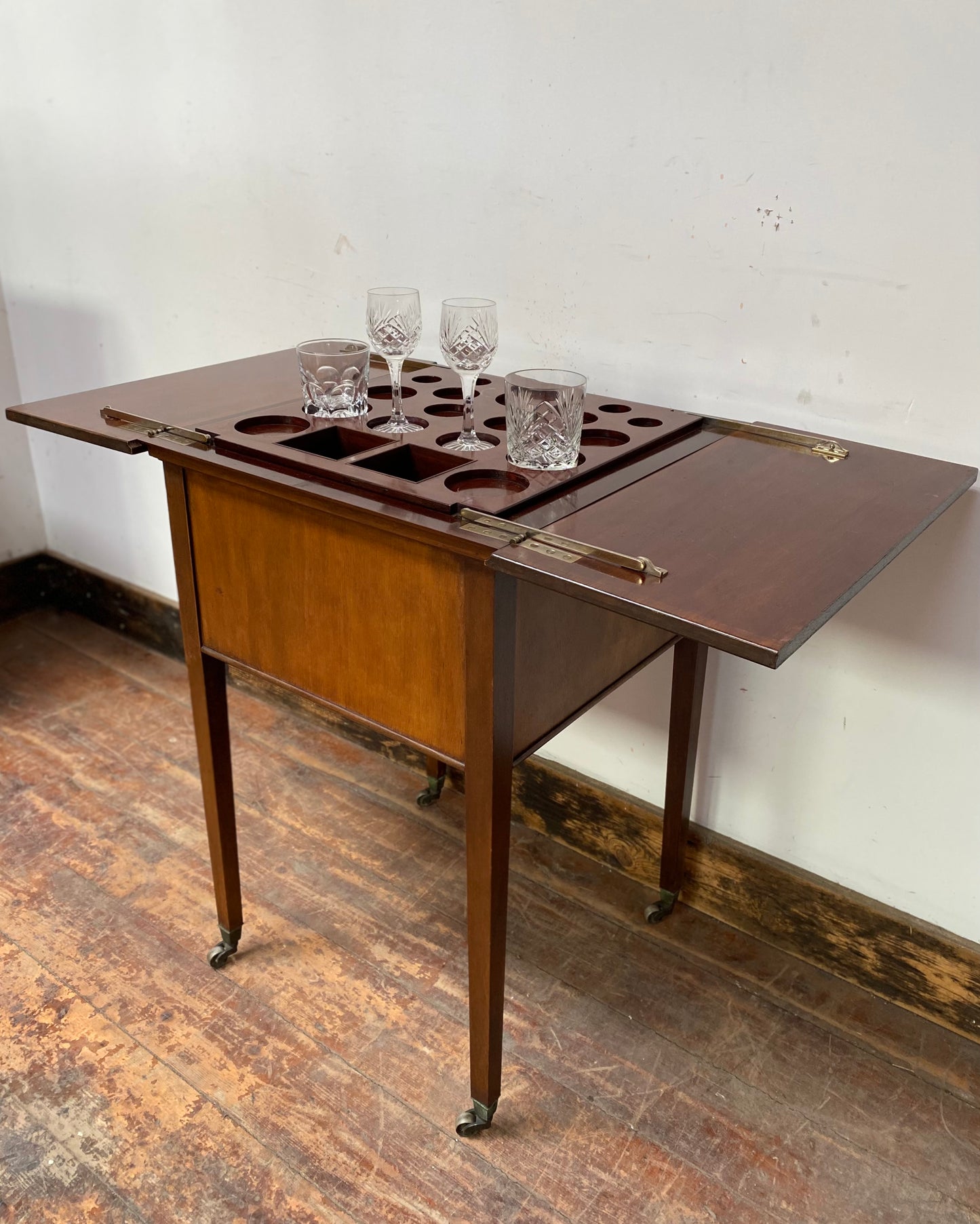 Antique 'rise and fall' hidden drinks cabinet