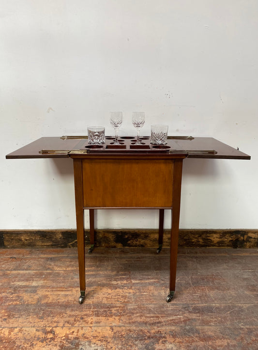 Antique 'rise and fall' hidden drinks cabinet